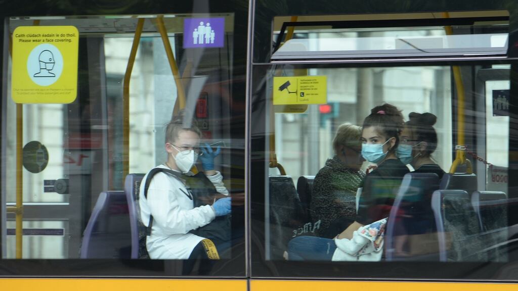 Passengers wearing face coverings on public transport in Dublin. Photograph: Alan Betson