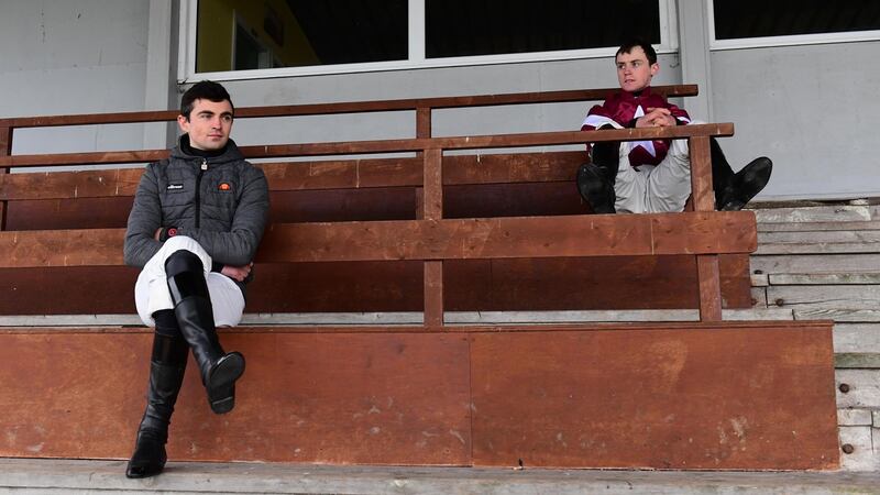 Jockeys Conor Orr and JJ Slevin watch the Handicap Hurdle at Thurles on Saturday. Photograph: PA