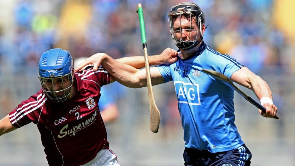 Johnny Coen of Galway tussles with Dublin’s Mark Schutte during yesterday’s Leinster SHC quarter-final clash at Croke Park. Photograph: Donall Farmer/Inpho