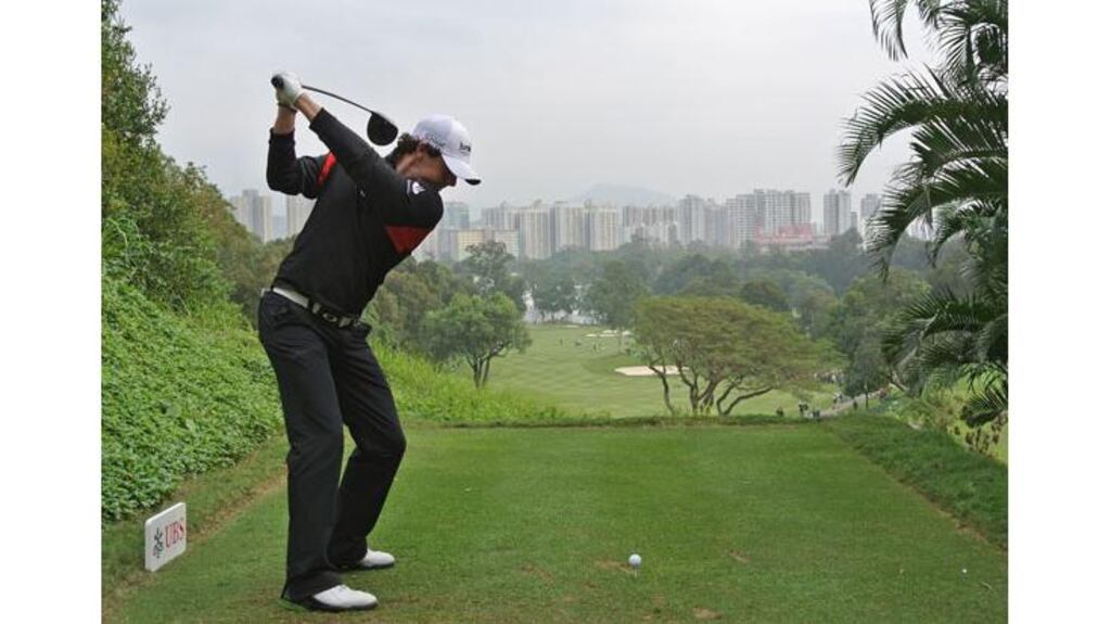 Rory McIlroy plays his tee shot on the second hole during the first round of the UBS Hong Kong Open at The Hong Kong Golf Club this morning. - (Photograph: Stuart Franklin/Getty Images)