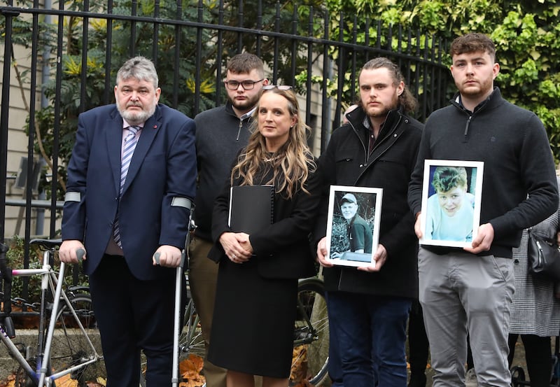 Kevin Fitzpatrick (left) with solicitor Niamh Ní Mhurchú and his three children outside the Four Courts. Photograph: Collins Courts