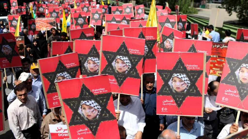 Iranians attend an annual pro-Palestinian rally marking Al-Quds (Jerusalem) Day in Tehran, Iran, yesterday. Ahead of his inauguration, Iran’s new president, Hassan Rouhani, was misquoted as saying that Israel is a wound that “should be removed”. Photograph: Ebrahim Noroozi/AP Photo