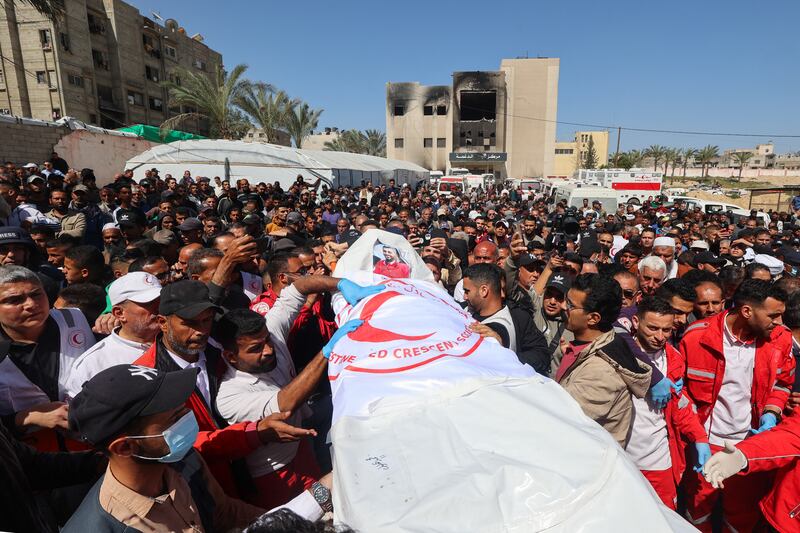 Members of the Palestine Red Crescent and other emergency services carry the bodies of fellow rescuers killed a week earlier by Israeli forces, during their funeral procession in Khan Younis on March 31st. Photograph: Eyad Baba/AFP via Getty Images