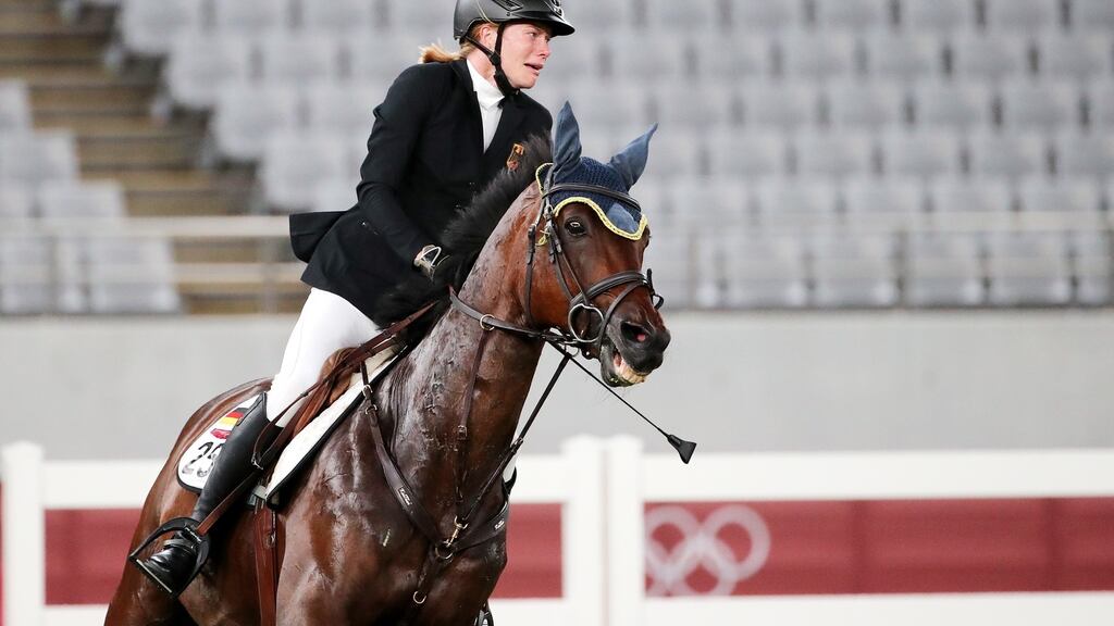 Germany’s Annika Schleu stuggles as she rides Saint Boy in the women’s individual riding show jumping modern pentathlon during the Tokyo 2020 Olympic Games. Photo: Tatyana Zenkovich/EPA