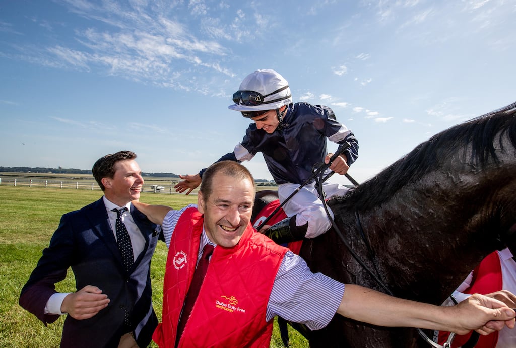 Donnacha O'Brien on Latrobe celebrates winning The Dubai Duty Free Irish Derby in 2018 with trainer and brother Joseph O'Brien. Photograph: Morgan Treacy/Inpho