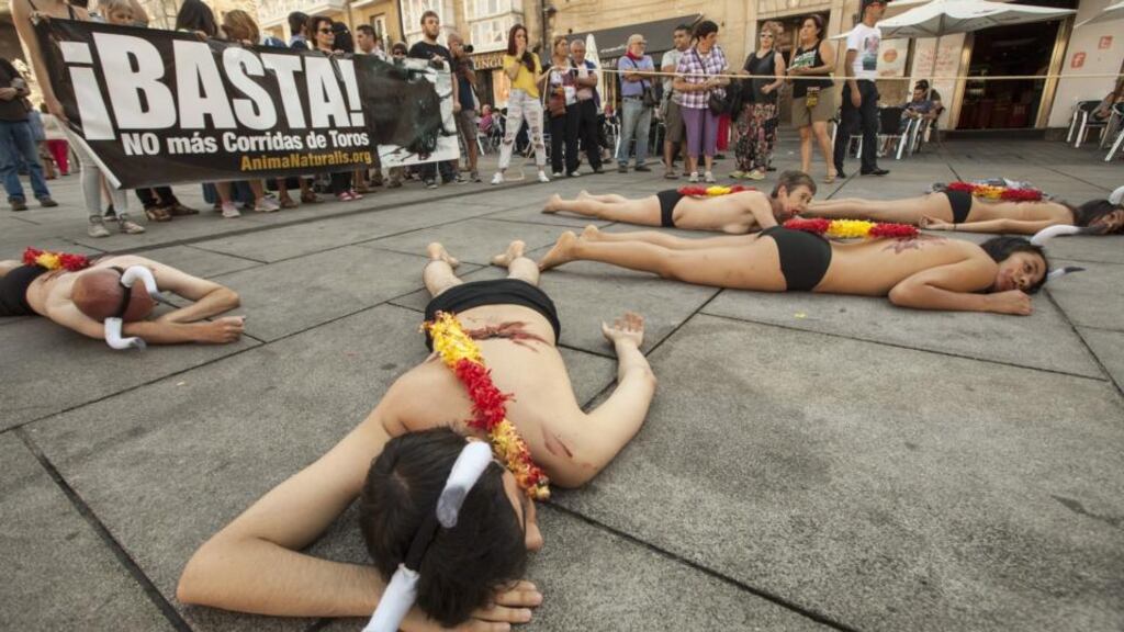 Activists lie half-naked covered in fake blood during a protest against bullfighting in Vitoria, northern Spain. Photograph: David Aguilar/EPA