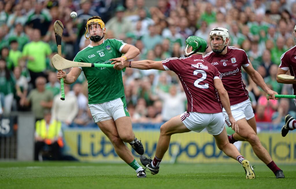 Limerick's Tom Morrissey on his way to scoring a goal despite the close attention of Galway's Adrian Tuohey at Croke Park. File photograph: The Irish Times