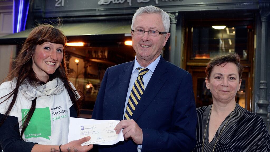 Sara Baume, winner of the 2014 Davy Byrne’s Short Story award, left, with Redmond Doran of Davy Byrne’s and Anne Enright, a former winner of the €15,000 award . Both authors have been shortlisted for the 2015 Costa Awards. Photograph: Dave Meehan