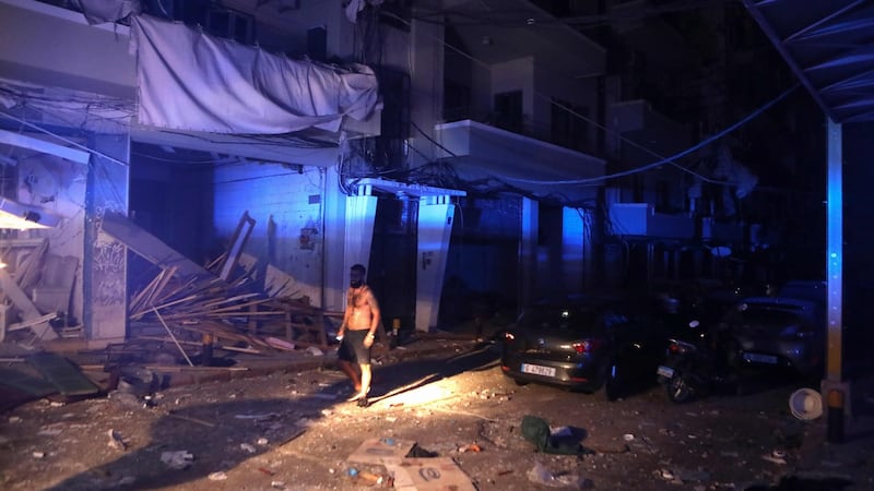A man walks in the partially destroyed neighbourhood of Mar Mikhael. Photograph: Patrick Baz/AFP via Getty Images