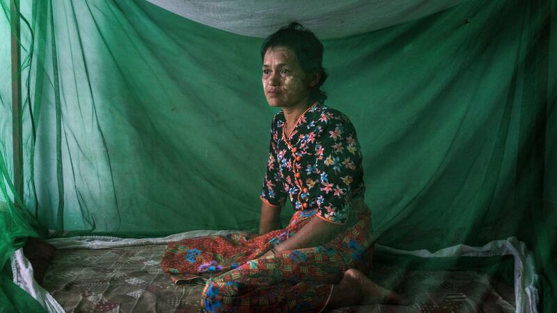 Daw Soe Chay poses for a portrait in Sittwe, Myanmar, on October 2nd.  Soe Chay, an ethnic Rakhine Buddhist from Myebon Township, was beaten and publicly shamed after her husband delivered aid to Rohingya Muslims in their camp in Sittwe. Photograph: Adam Dean/The New York Times