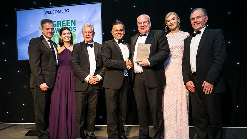 Michael Baumgart, Executive Sales Director at CBRE, presents the Green Large Organisation of the Year award to An Post team.