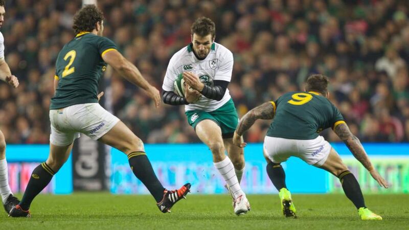 Ireland centre Jared Payne is tackled by Bismarck Du Plessis and Francois Hougard of South Africa on Saturday. Photograph: Patrick Bolger/Getty Images