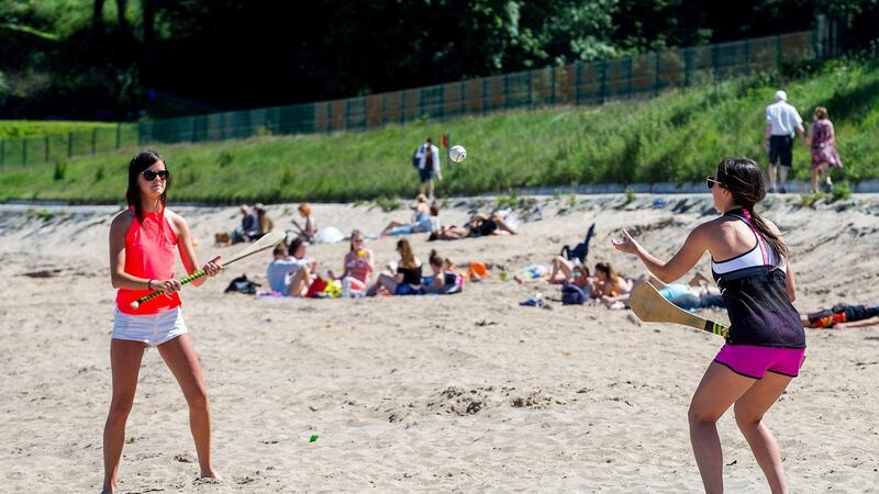 Orlagh McCollum (left) and Rachel Mulholland enjoying the weather at Crawfordsburn Country Park beach, Helen’s Bay, in Northern Ireland. Photograph: PA