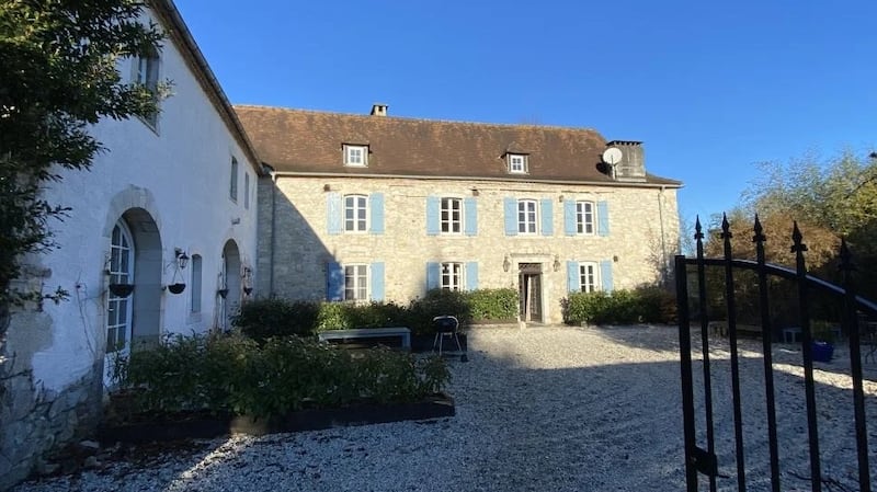 This French farmhouse has a large swimming pool in mature gardens