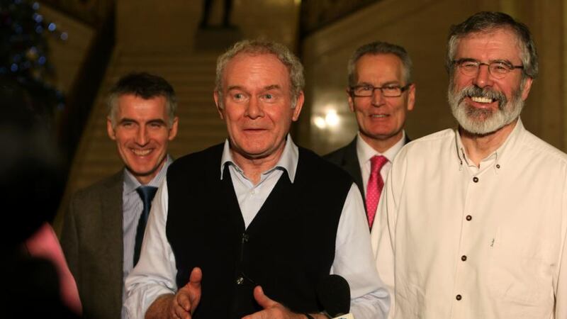 Sinn Féin Deputy First Minister Martin McGuinness (second left) and party leader Gerry Adams at Stormont: ‘There are aspects we can be proud of – it’s a good day,’ said Adams. Photograph: Brian Lawless/PA Wire.