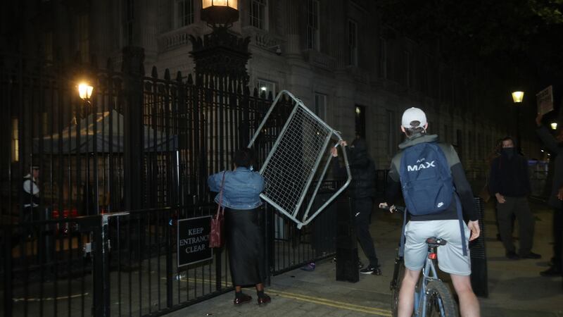 Protesters throw barricades at the gates of Downing Street during a Black Lives Matter protest rally in London. Photograph: Yui Mok/PA Wire