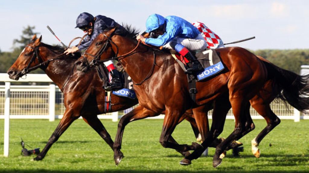 Frankie Dettori and Poet's Voice (nearside) - against Johnny Murtagh and Rip Van Winkle (farside) - go on to win The Queen Elizabeth II Stakes at Ascot. Photograph: PA Wire.