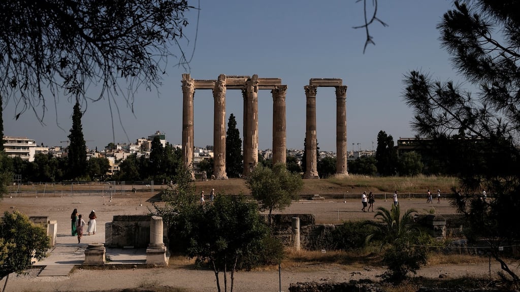 People visit the archaeological site of the ancient Temple of Zeus, a symbol of ‘the glory that was Greece’, in Athens. Photograph: Alkis Konstantinidis/Reuters