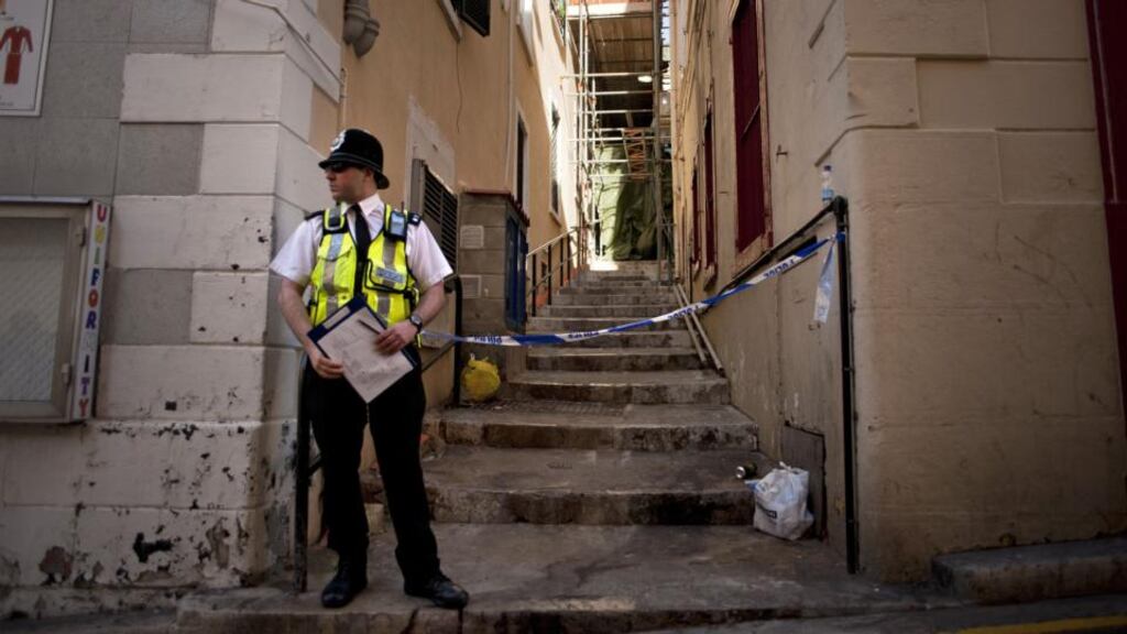 A policeman stands guard in Boschetti Street in Gibraltar where four people including a baby were found dead on March 30th, 2015. Photograph: Jorge Guerrero/AFP/Getty Images