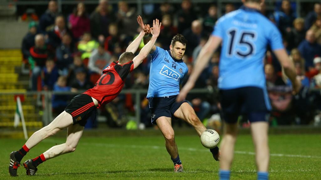 Down’s Joe Murphy attempts to block Dublin’s Kevin McManamon during the Allianz Football League Division One game at Páirc Esler in Newry. Photograph: William Cherry/Inpho/Presseye