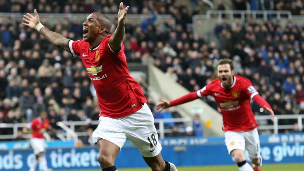 Manchester United’s Ashley Young celebrates scoring the wining goal in the Premier League game against Newcastle United at St James’ park. Photograph: Lindsey Parnaby/EPA