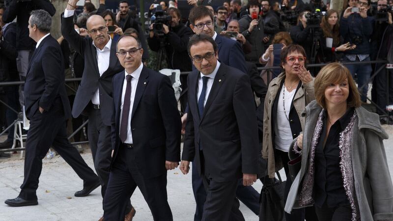 Former members of the Catalan government (left to right): Joaquin Forn, Raul Romeva, Josep Rull, Carles Mundo, Jordi Turull, Dolors Bassa and Meritxel Borras arrive at Spain’s National High Court today in Madrid, Spain. Along with ousted president Carles Puigdemont they were ordered to appear on charges of rebellion, sedition and misuse of public funds following the unilateral declaration of independence. Photograph: Pablo Blazquez Dominguez/Getty Images