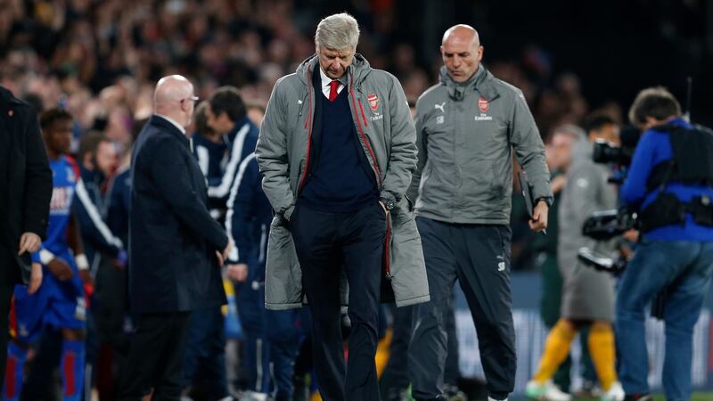 Arsene Wenger leaves the pitch at the end of the game. Photo: Matthew Childs/Reuters