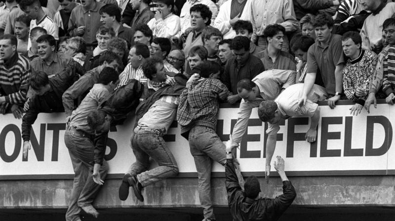 Liverpool fans trying to escape severe overcrowding at a match at Hillsborough in Sheffield on April 15th, 1989. Photograph: David Giles/PA Wire