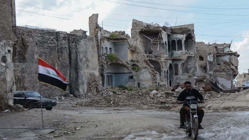 A man rides a motorcycle among devastated buildings in the old city of Mosul on April 21st, 2019. Photograph: Getty Images