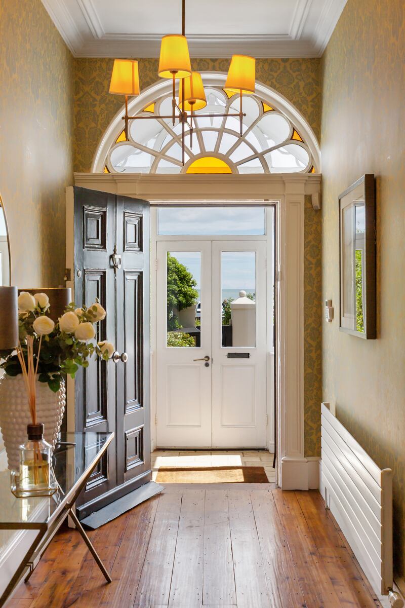 Front hall with stained-glass fanlight and original polished floors