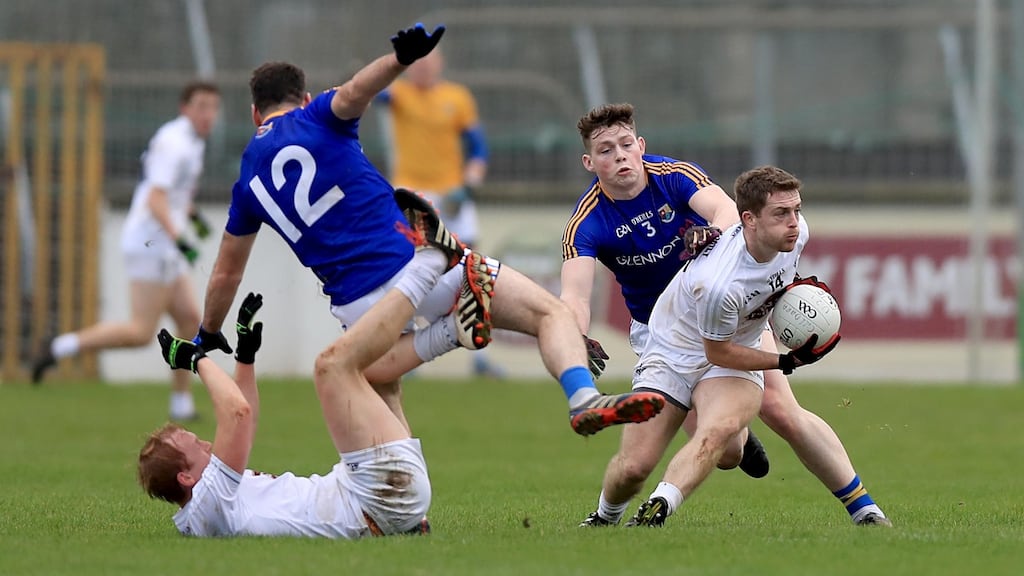 Kildare’s Niall Kelly and Keith Cribbin with Diarmuid Masterson and Andrew Farrell of Longford during their O’Byrne Cup clash. Photo: Donall Farmer/Inpho