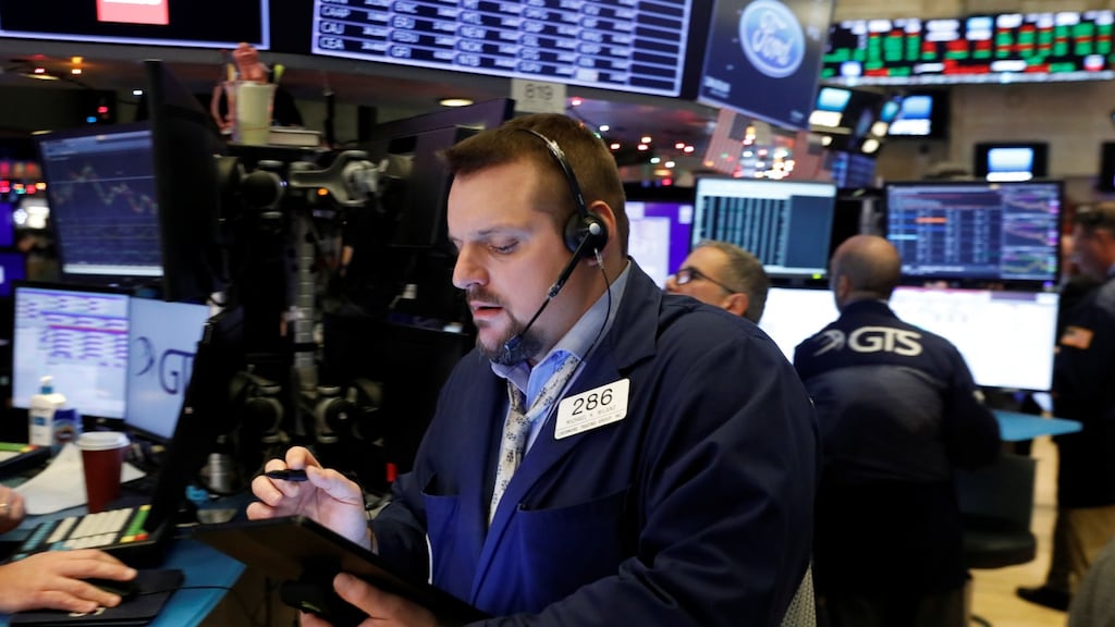 Traders work on the floor of the New York Stock Exchange shortly after the opening bell in New York. Photograph: Lucas Jackson/Reuters