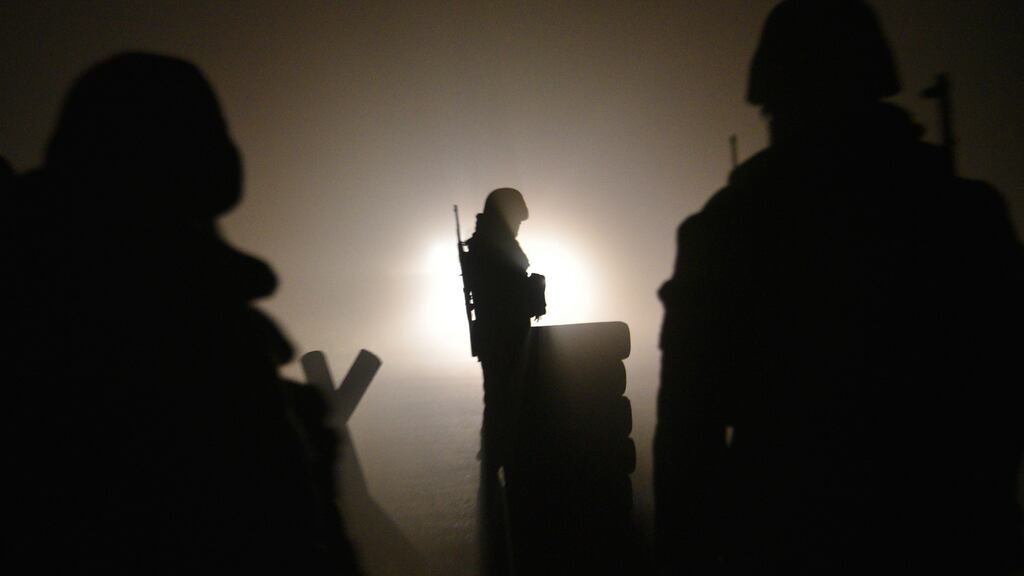 Armenian soldiers stationed at a checkpoint outside Agdam supervise the last vehicles leaving the region as the territory is due to be returned to Azerbaijan. Photograph: Getty
