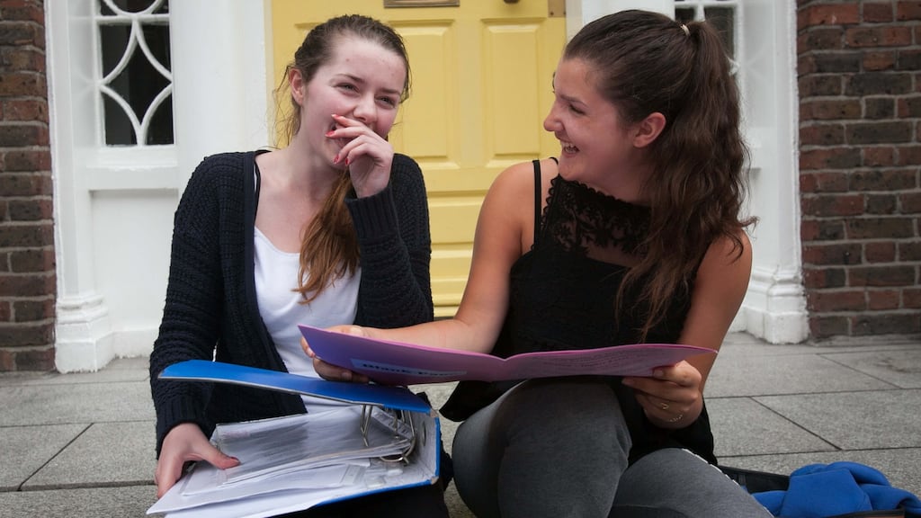 Institute of Education students Katie Pollard and Julie Alexia Dias relax after their English Leaving Cert exam. Photograph: Gareth Chaney Collins