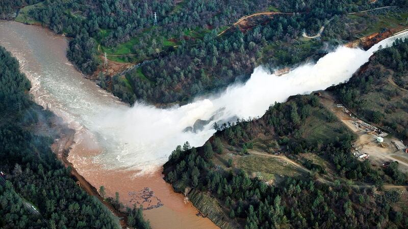 Water running down the main spillway at Lake Oroville on Monday. The water level dropped Monday behind the nation’s tallest dam, reducing the risk of a catastrophic spillway collapse. Photograph: Randy Pench/AP