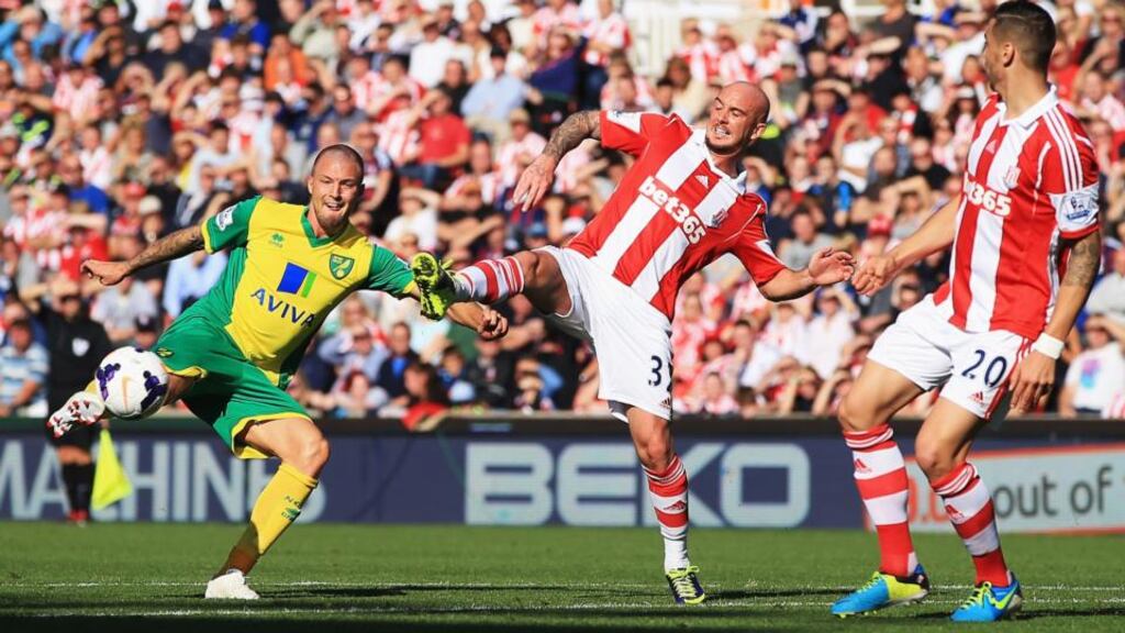 Anthony Pilkington of Norwich City is closed down by Stephen Ireland of Stoke City during the Premier League match at the Britannia Stadium. Photograph: Richard Heathcote/Getty Images