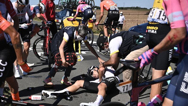 Ireland’s Nicolas Roche lies on the ground after crashing during the 10th stage. Photograph: Anne-Christine Poujoulat/AFP via Getty Images