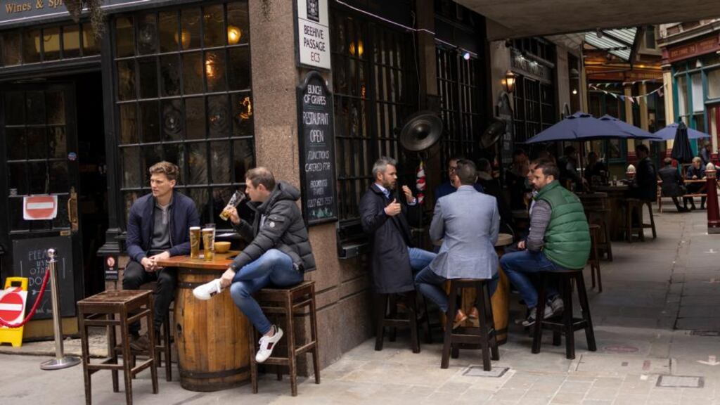 Workers enjoy drinks in a pub near Leadenhall Market in London, England. Photograph: Dan Kitwood/Getty Images