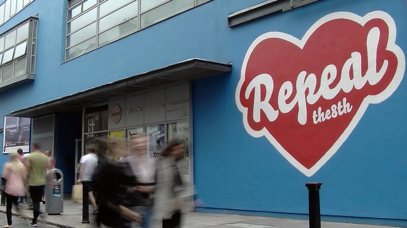 Graffiti artist Maser puts the writing on the wall. Photograph: Enda O’Dowd