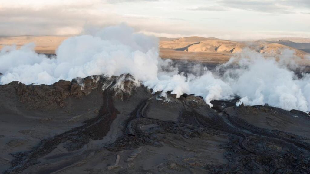 Steam and smoke rise over a 1-km-long fissure in a lava field north of the Vatnajokull glacier, which covers part of Bardarbunga volcano system. Reuters/Marco Nescher