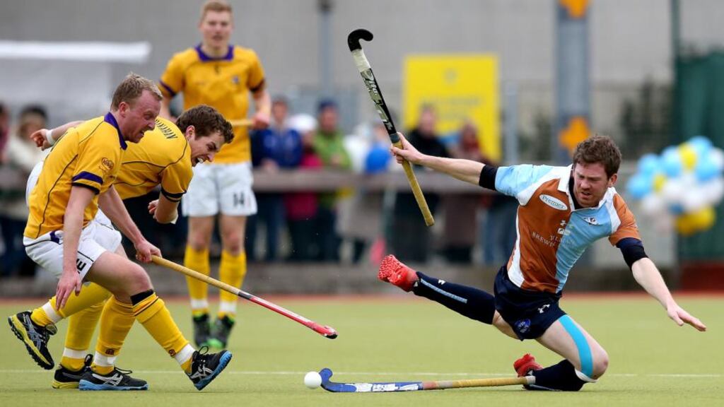 Pembroke’s Patrick Shanahan and Maurice Elliott tackle Michael Maguire of Three Rock Rovers. Photograph: James Crombie/Inpho