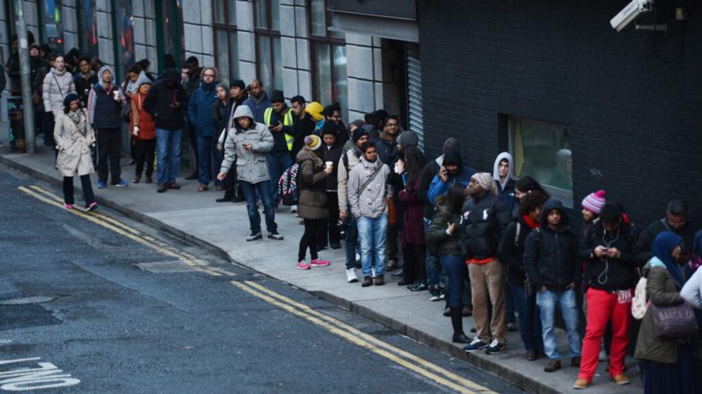 A queue on Poolbeg Street waiting for the Garda National Immigration Bureau to open on Burgh Quay. “A policy of large planned increases in the amount of immigration into the EU, while also politically challenging, may turn out to be the only way to keep the European economy expanding in the future”