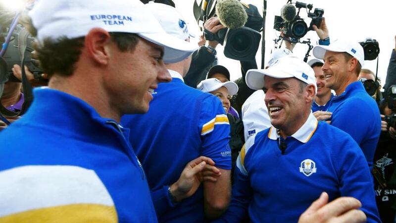 Rory McIlroy (left) and Europe captain Paul McGinley celebrate Jamie Donaldson won his match against US player Keegan Bradley to retain the Ryder Cup at Gleneagles. Photograph: Eddie Keogh /Reuters