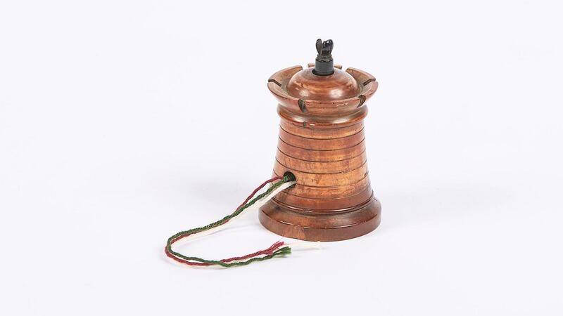 String barrel thread holder from 19th century in lignum vitae, (€350), O Sullivan Antigues, Francis St, Dublin.
