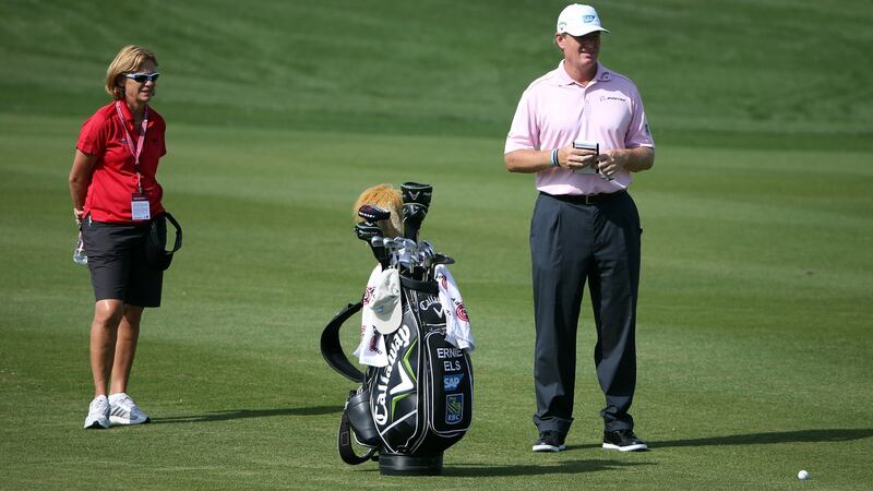 Dr Sherylle Calder working with Ernie Els at the Qatar Masters at The Doha Golf Club. Photograph: Ross Kinnaird/Getty Images