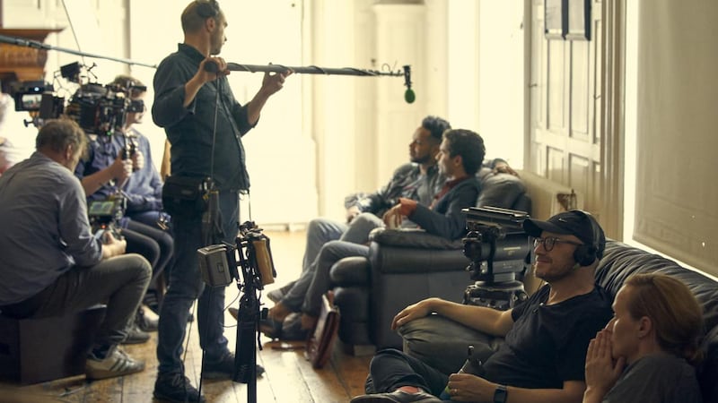 Director Lenny Abrahamson (second right) and producer Catherine Magee (far right) watch filming of a scene of Normal People in July 2019