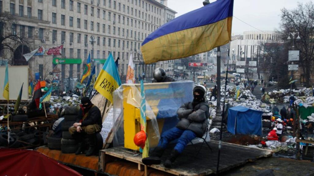 Anti-government protesters rest at the barricades in Kiev this week. Rallies on Kiev’s Independence Square, or Maidan, have attracted people from many countries, including Russia. Photograph: David Mdzinarishvili/Reuters