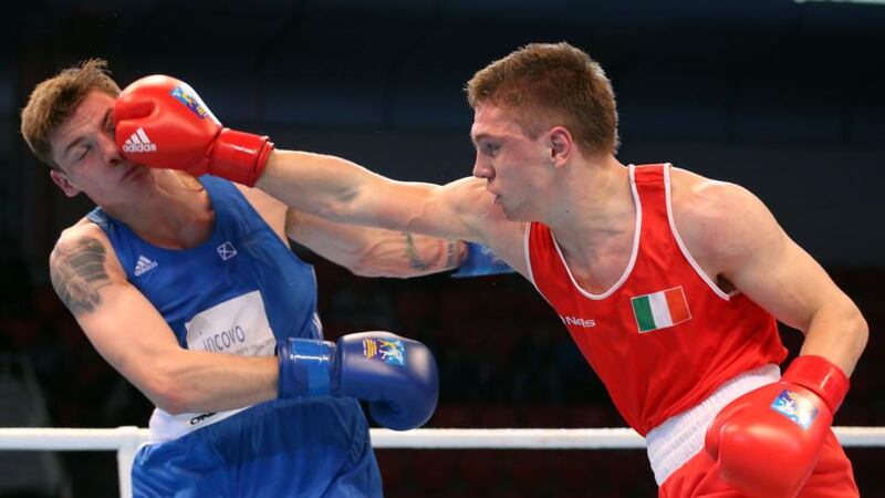 Ireland’s Jason Quigley (right) lands a blow on Aston Brown of Scotland in Almaty. Photograph: Cathal Noonan/Inpho