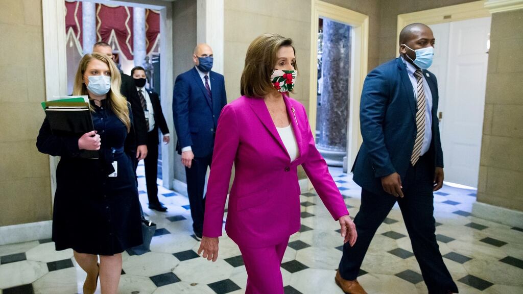 US Speaker of the House Nancy Pelosi (C) walks from the House floor to her office on Capitol Hill in Washington, DC, on Friday before the passing of the Bill. Photograph: Michael Reynolds/EPA