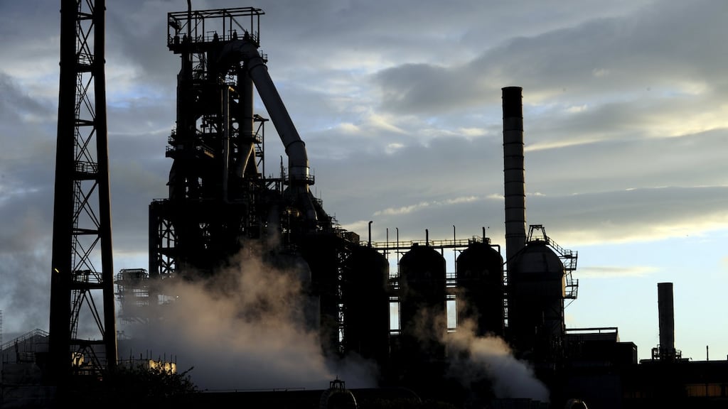 One of the blast furnaces of the Tata Steel plant is seen at sunset in Port Talbot, South Wales. India’s Tata Steel is due on Monday to begin the formal sale process for its loss-making British units. (Photograph: Rebecca Naden/Reuters)
